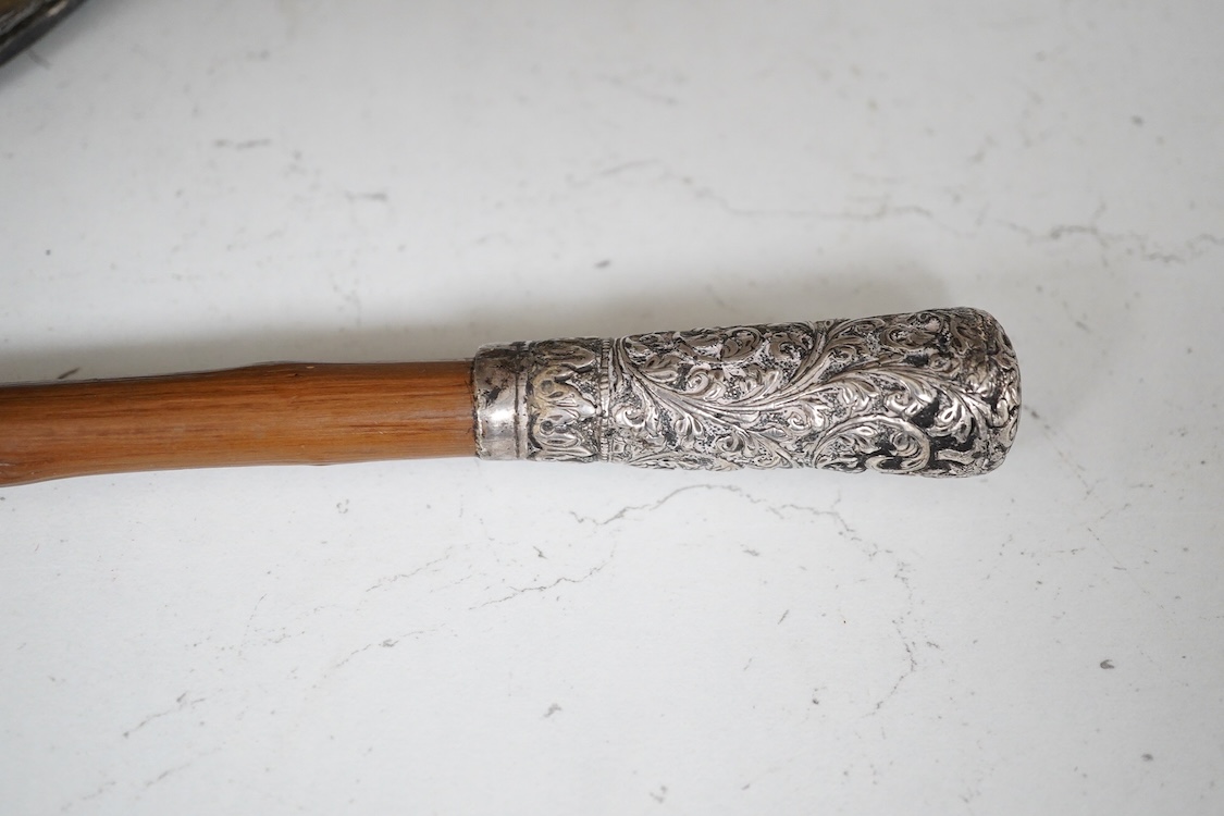 A Victorian electroplate mounted memorial horse hoof inkwell, 11cm high and a white metal mounted riding crop